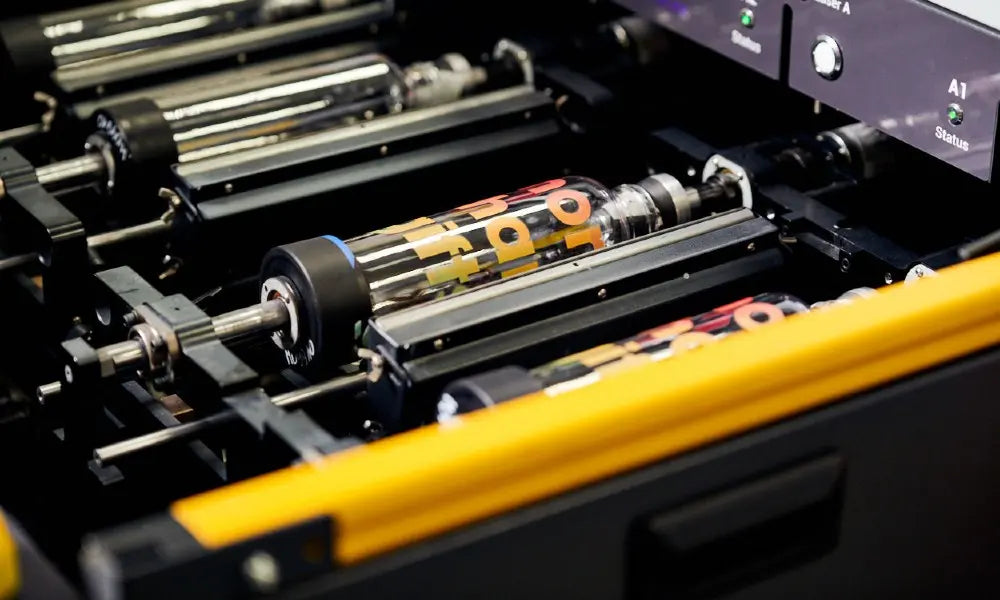 Bottles in a UV printing machine