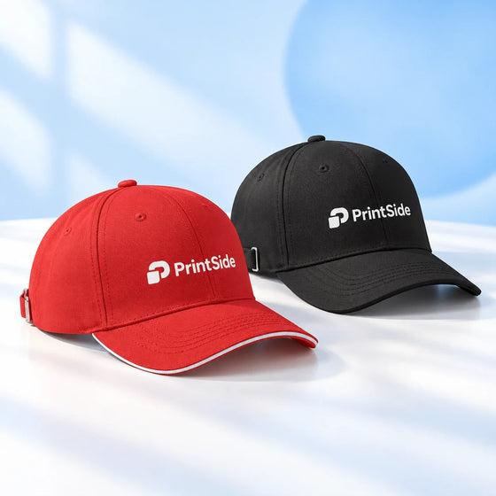 Red and black baseball caps with PrintSide logos.