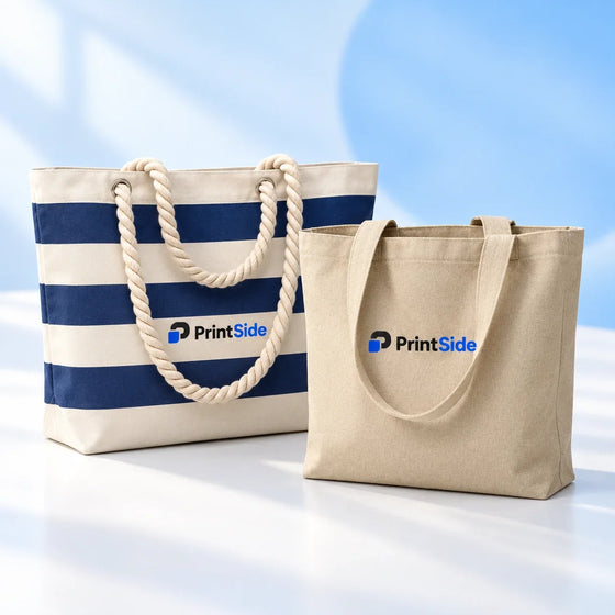Navy-striped rope-handle beach bag and natural canvas tote with PrintSide logos.