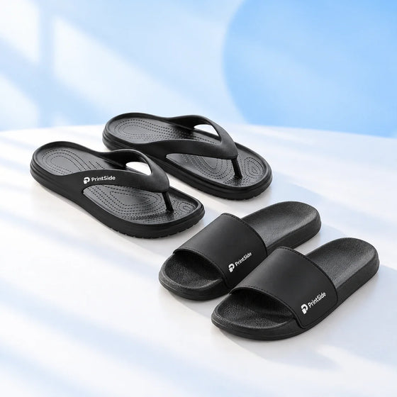 Black flip-flops and beach slides with PrintSide branding.