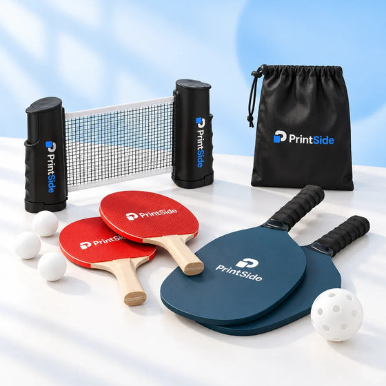 Table tennis set with a retractable net beside blue paddle bats, all with PrintSide branding.