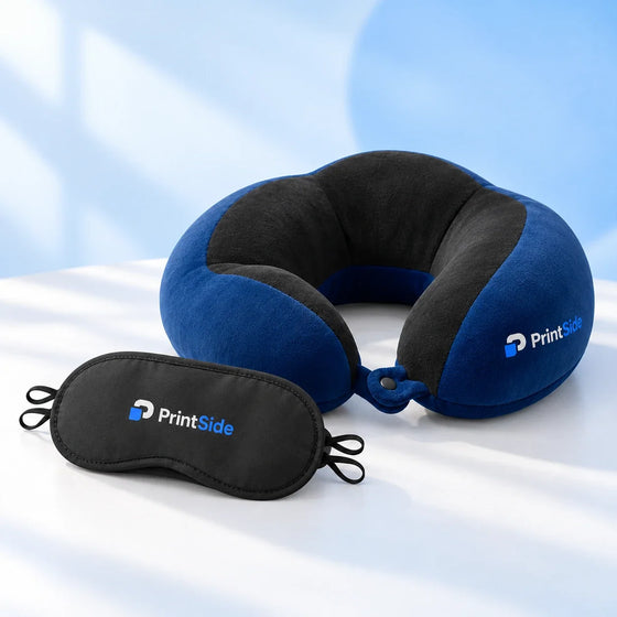 Black sleep mask and blue-and-black travel pillow with PrintSide logos.