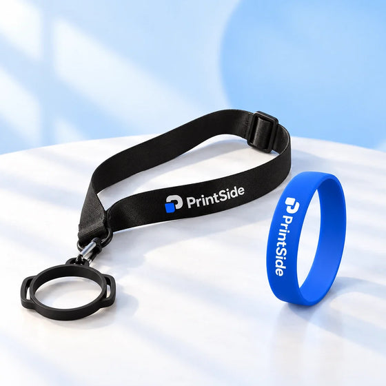 Black cup-holder lanyard and blue silicone wristband with PrintSide logos.