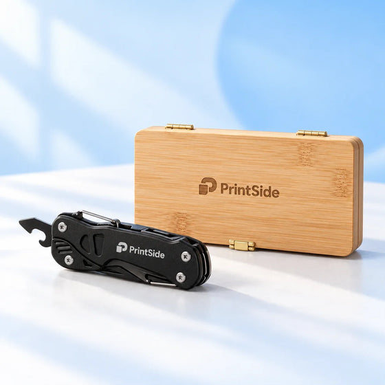 Black pocket multitool and bamboo tool case with PrintSide logos.