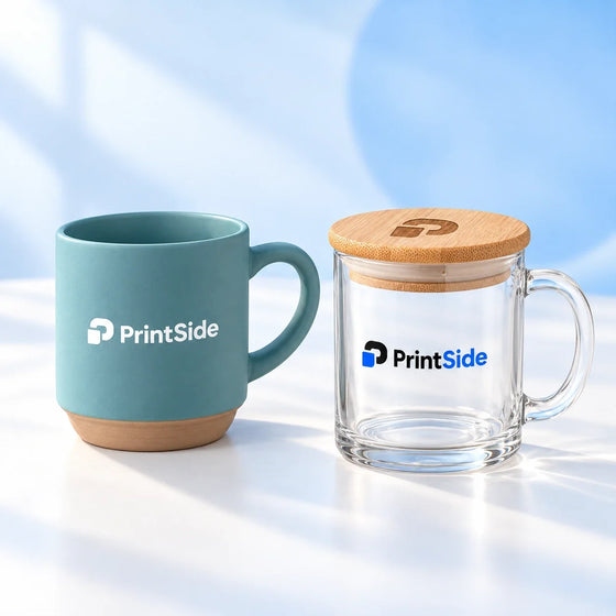 Teal ceramic mug and clear glass mug with a bamboo lid and PrintSide logos.