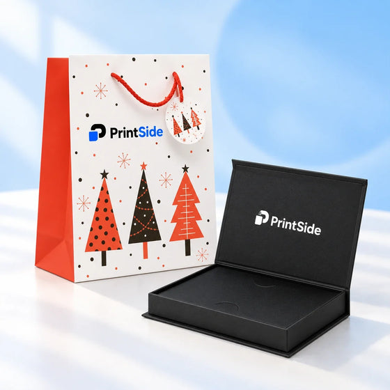 Open black gift-card box and festive white-and-red paper bag with PrintSide branding.