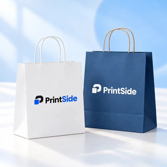 White and navy paper shopping bags with twisted handles and PrintSide logos.