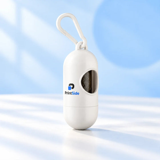 White capsule-shaped pet waste bag dispenser with a clip and PrintSide logo.