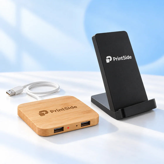 Bamboo charging pad and black wireless charging stand with PrintSide logos.